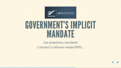 Text Slide: 'Government's Implicit Mandate: Use proprietary standards!' Includes the NZ Gov'ts Government Electronic Tendering System's logo, GETS.govt.nz